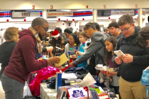 Students shopping and paying with positive behavior points.