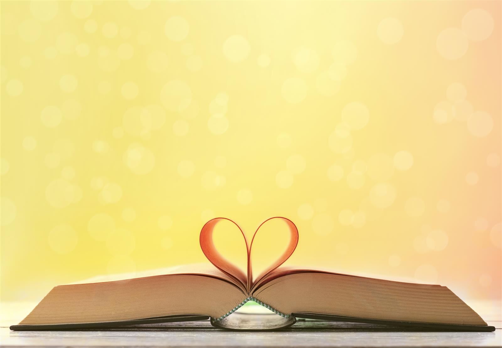 open book with pages folded in to look like a heart open book with pages folded in to look like a heart