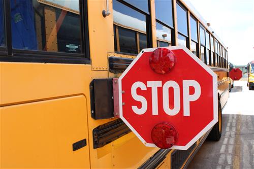 Passing a school bus while the stop arms are out is illegal