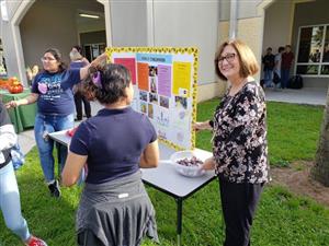 Ms. Peeler at Bulldog Union Showing off her program 