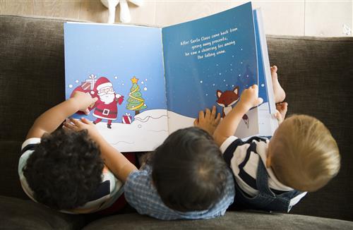 Children reading a book 