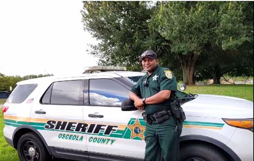 SRO next to patrol car