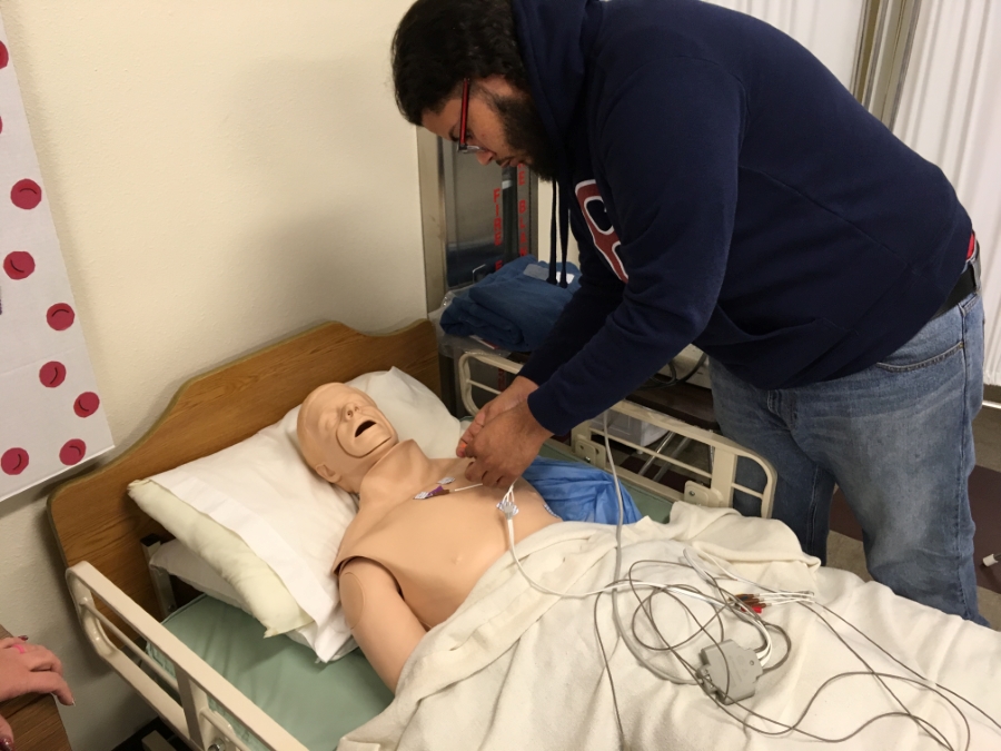Student working with a practice patient.